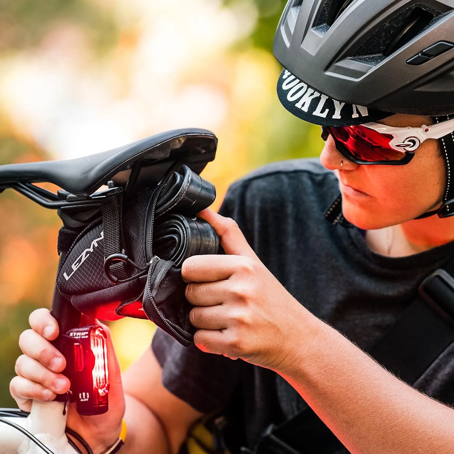 LEZYNE Strip Drive Pro Alert Rear - Bicycle USB Rechargeable Durable Weather-Resistant IPX7 White LED Tail Light with Solid & Flash Modes | Includes Silicone Rubber Mounting Strap | 300/400 Lumens