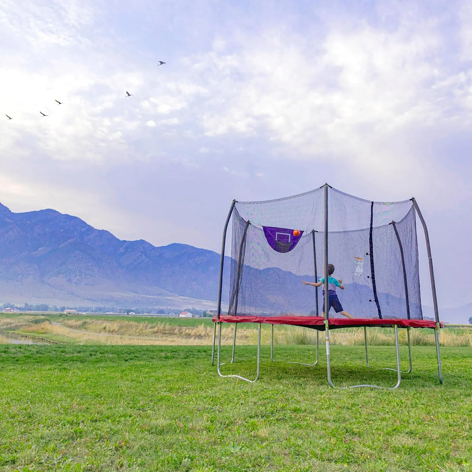Skywalker Trampoline Outdoor 8 FT, 12 FT, 15 FT Jump N’ Dunk Round Outdoor Trampoline with Net, Trampoline Mat, and Basketball Hoop for Trampoline